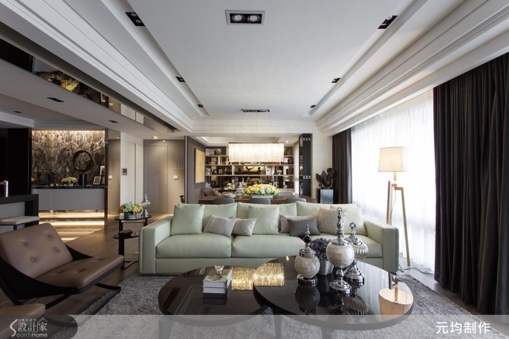 原先為天花樑體低矮的狹長空間，讓視覺略感壓迫，設計師運用巧思，重塑大器氣勢。
