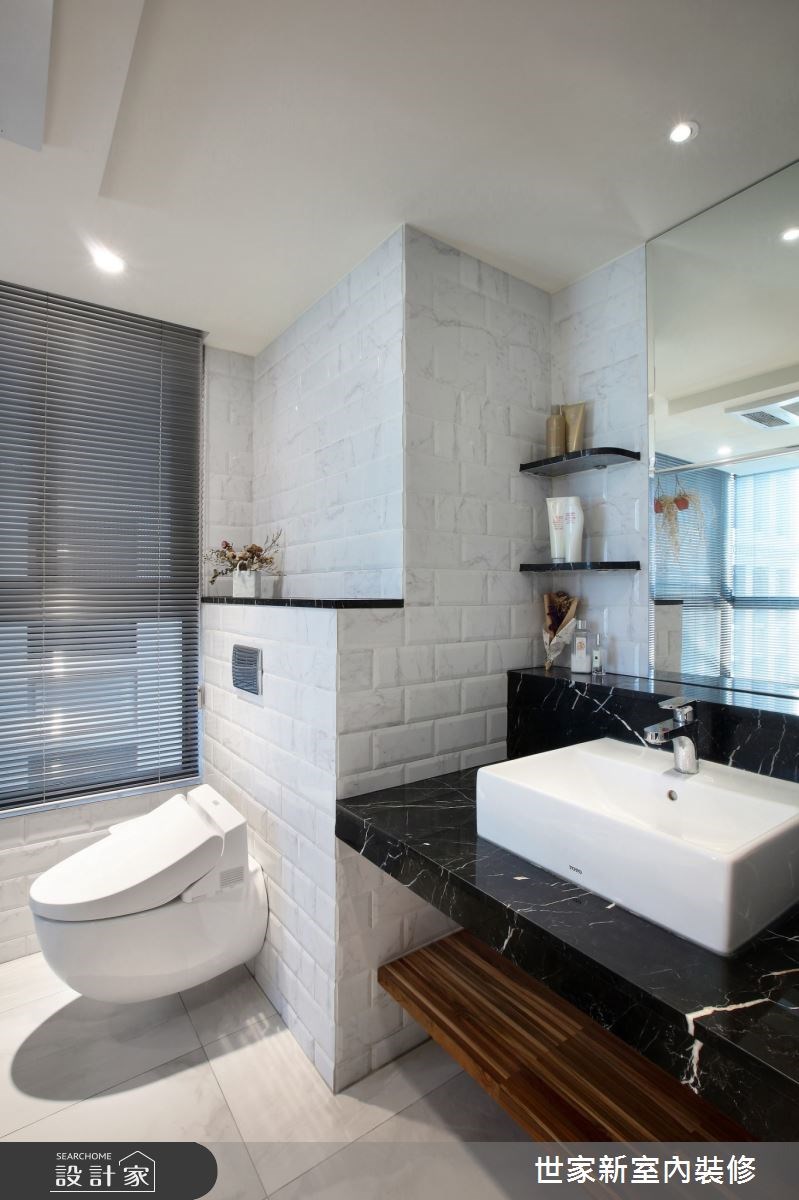 以時尚黑白色調為主軸的 39 坪混搭風住宅，設計師將屋