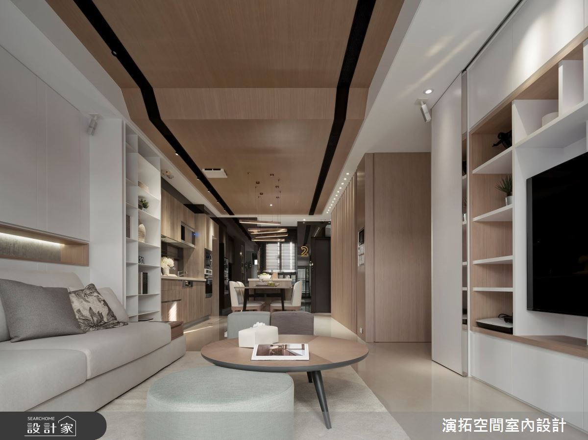 公領域天花板採用連續的木質元素,消弭空間的界線轉折,展開遼闊開放的空間視感。