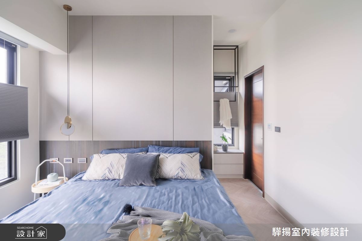 主臥以灰色系木紋與石材紋理的堆疊,創造沉靜氣息的舒眠空間。