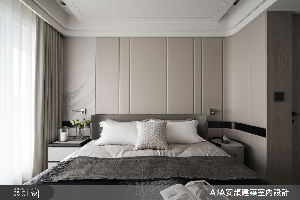 主臥的弧形床頭與皮革設計營造柔和氣氛,大板磚的對比則增添視覺層次。