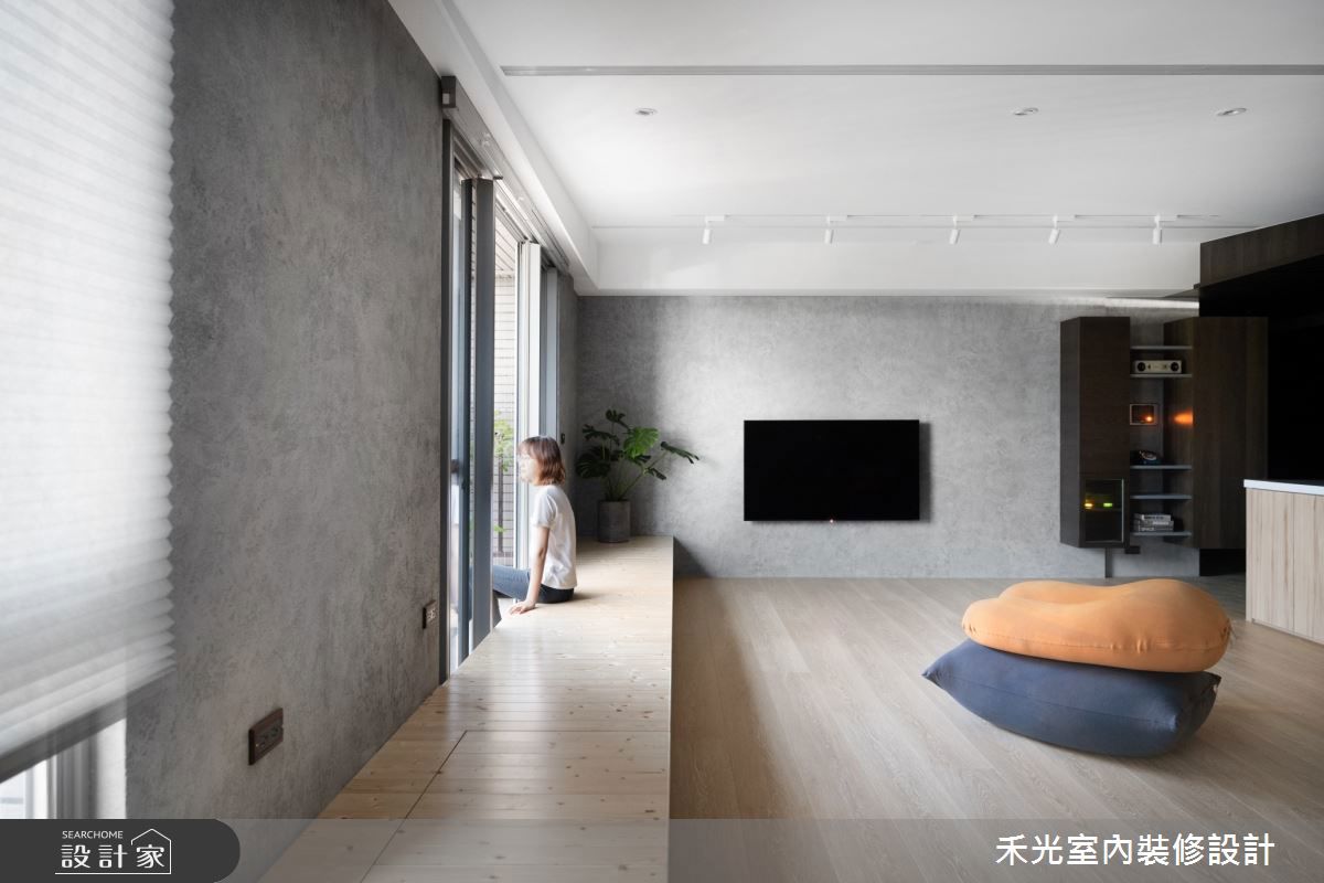 水泥的冰冷、粗獷感與木材的溫潤形成強烈對比