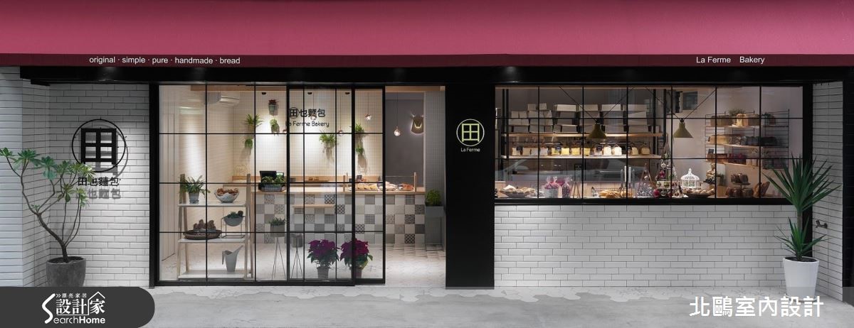 城市中有一間引人駐足的麵包店,外觀牆面以大量純白磁