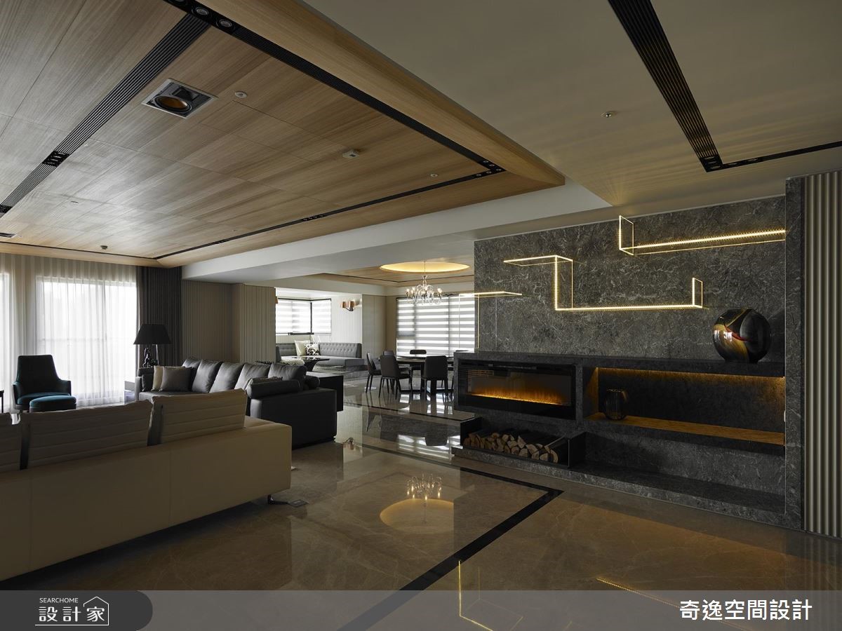 在百坪現代感的宅邸裡,壯闊石材鋪陳地坪與壁面,天花